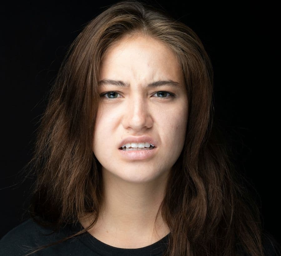 A woman with a look of disgust.